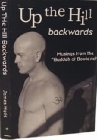 Picture of a bald man looking chiselled and intent. Jim Hyde's book Up the Hill Backwards