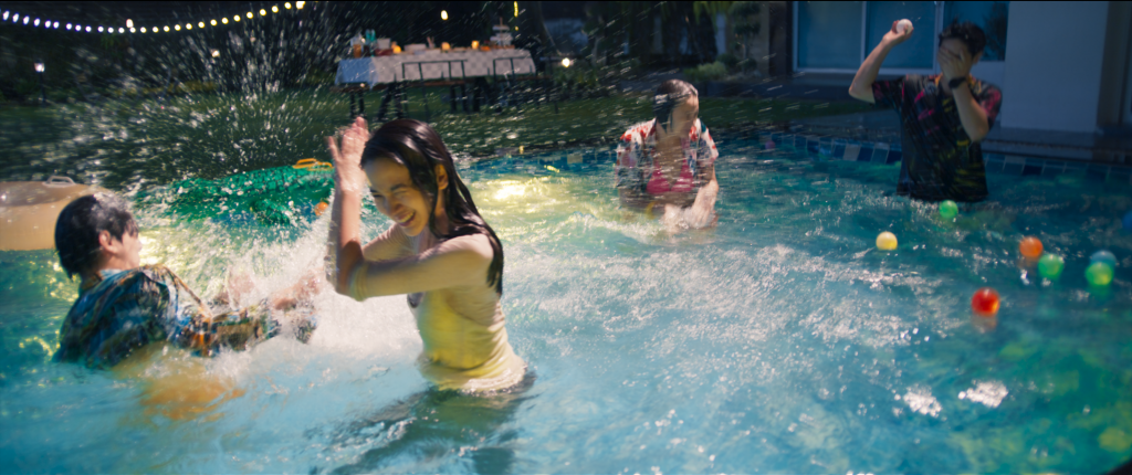 Teens in a pool with clothing on and splashing around (The Deep)