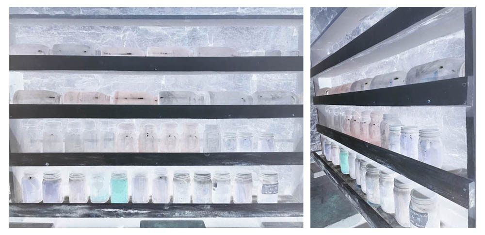 Glass jars of unknown substances line the shelves along the walls