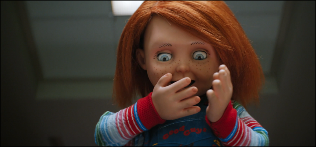 Chucky - S1 E6 - "Cape Queer" screenshot of Chucky feigning shock