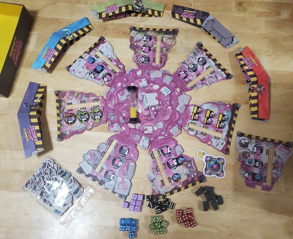 The game's components laid out on a wooden table.