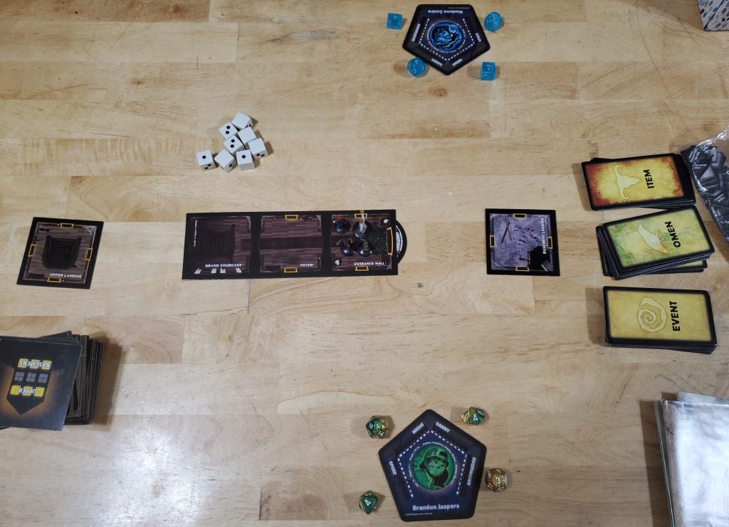 Setup for a four-player game of Betrayal.