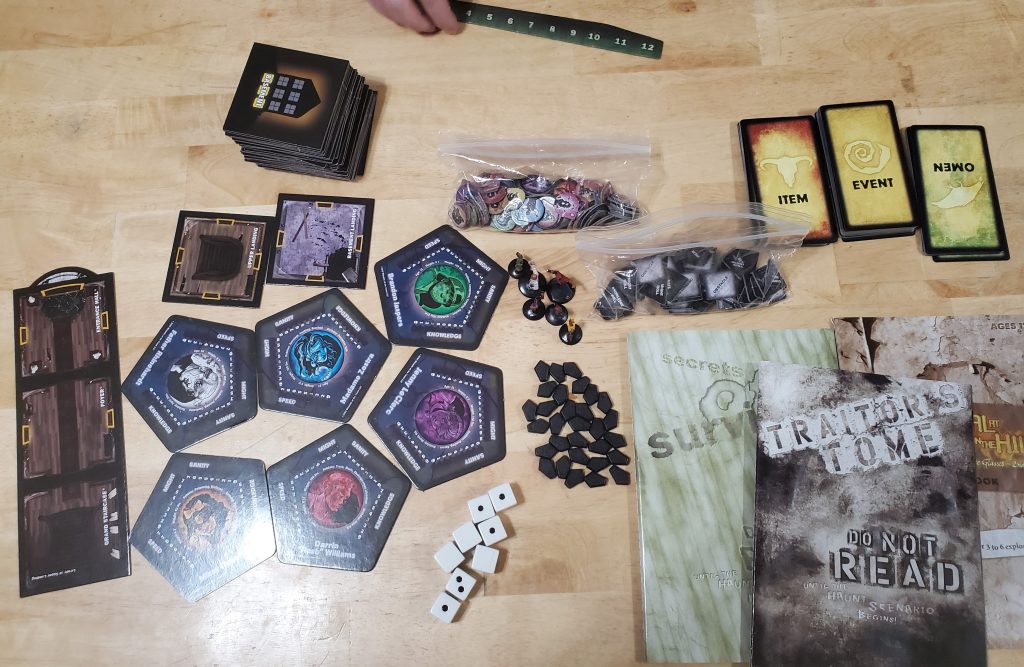 The components of the game laid out on a table.