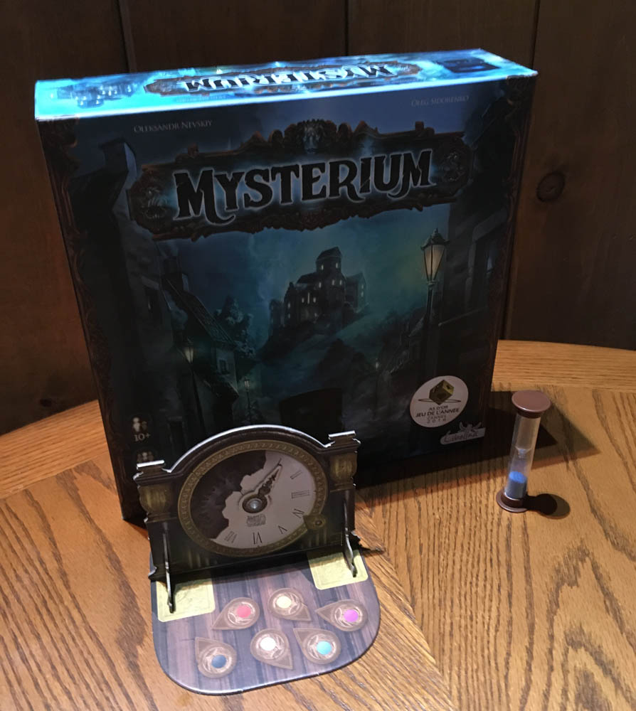 Mysterium physical game box and time tracking pieces.