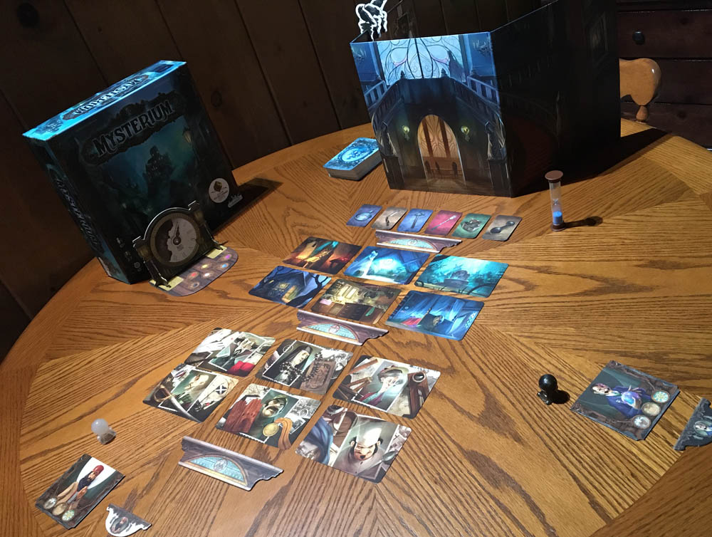 Setup for the physical game from the psychic's perspective, looking at the lineup of suspects, locations and weapons arrayed before the looming barrier of the Otherworld.