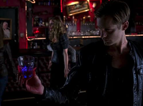 TrueBlood S6E2 Eric holding a cup with the new bullet inside of it