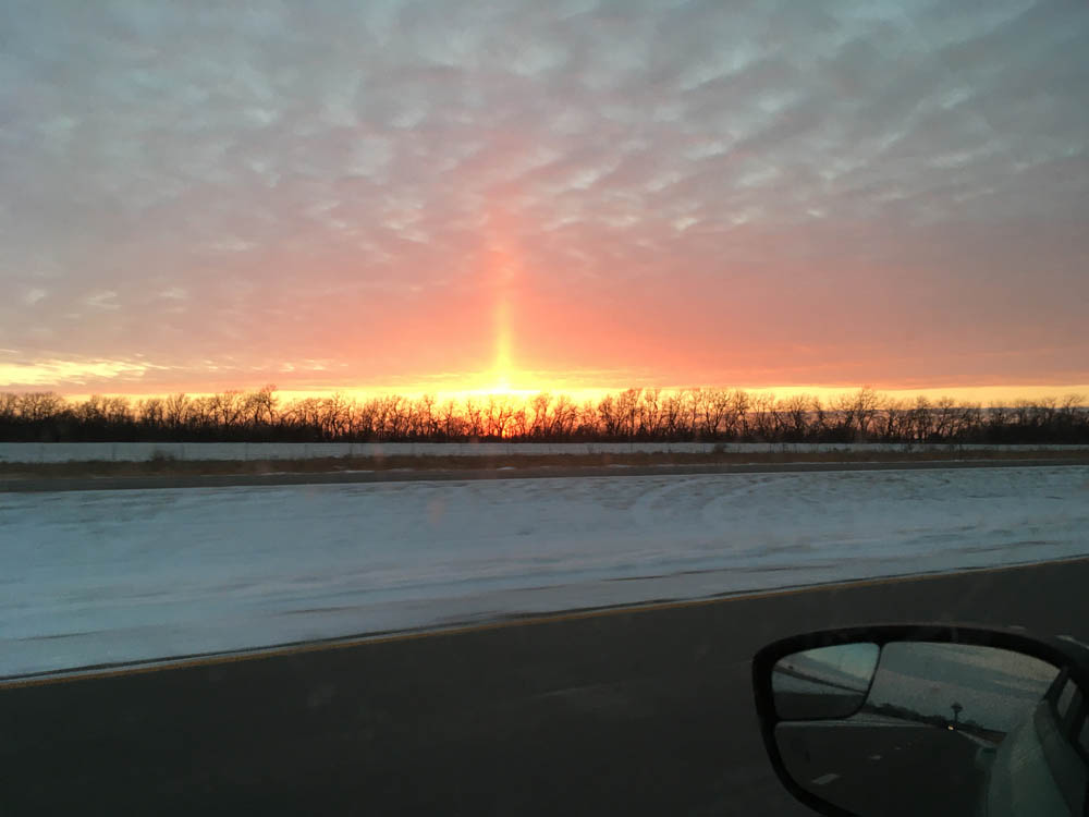 another image of the country drive with a blast of light shooting off into the atmosphere from their signal beacon