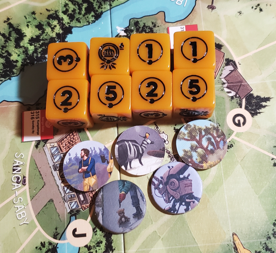 The games dice and 5 of the game's scenario tokens
