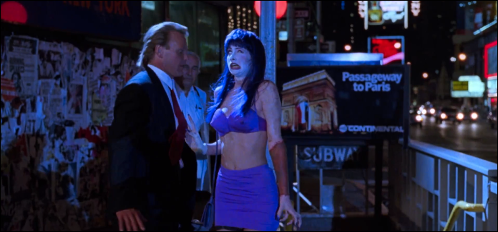 Still from 'Frankenhooker' (1990) depicting the titular undead escort working a John in NYC, one of the movies on The Last Drive-In with Joe Bob Briggs Heartbreak Trailer Park on Shudder