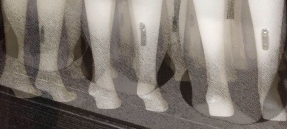 Mannequin feet in the air, detail from featured image with the writer