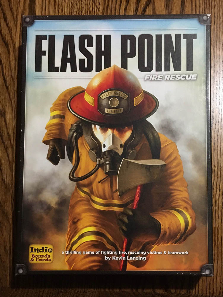 Flash Point Fire Rescue box with image of a firefighter running at you with an axe; game by Kevin Lanzing and brought to you by Indie Boards & Cards