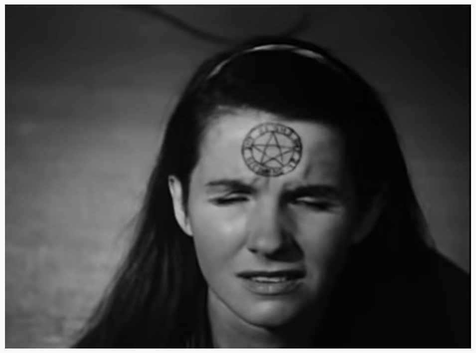 Still from Witch's Cradle by Maya Deren & Marcel Duchamp: Is The Beginning Is The End...  pentacle drawn on woman's forehead