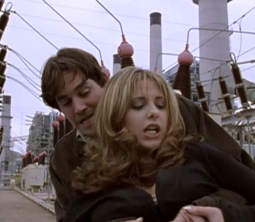 Buffy S1E2 - Buffy being hugged aggressively by a guy.