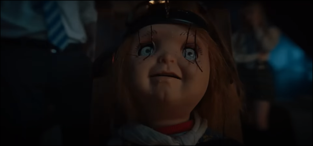 Still from Chucky - S2 E3 - "Hail, Mary!" of Chucky being brainwashed.