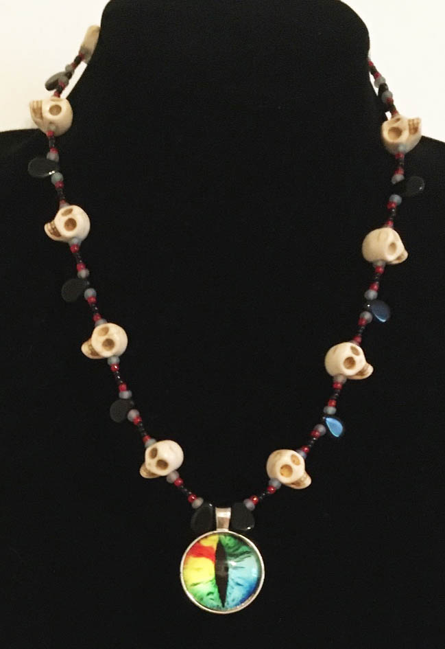Eye Candy Necklace by Jennifer Weigel with rainbow Evil Eye and magnesite stone skulls