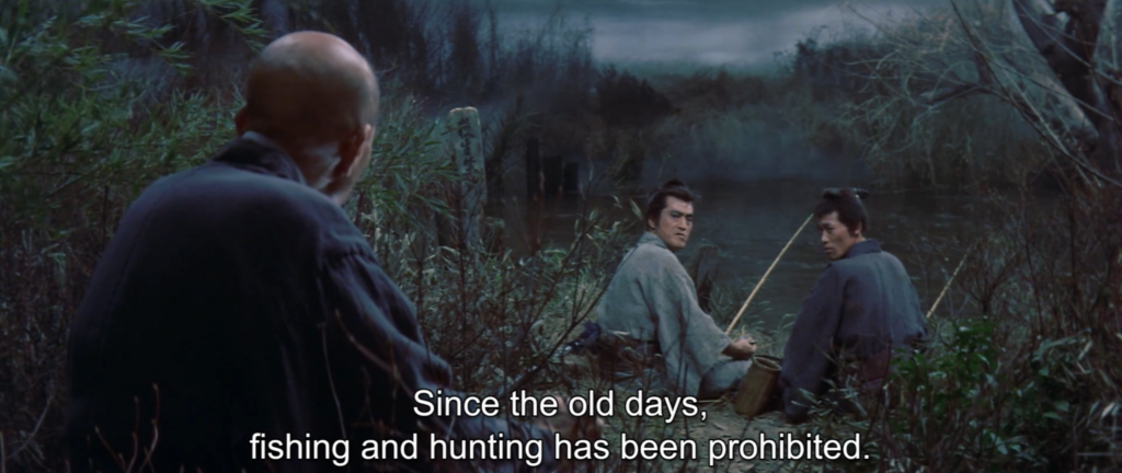 An old man confronts two fishing men who sit on the bank of a river holding fishing rods. Text: Since the old days, fishing and hunting has been prohibited.