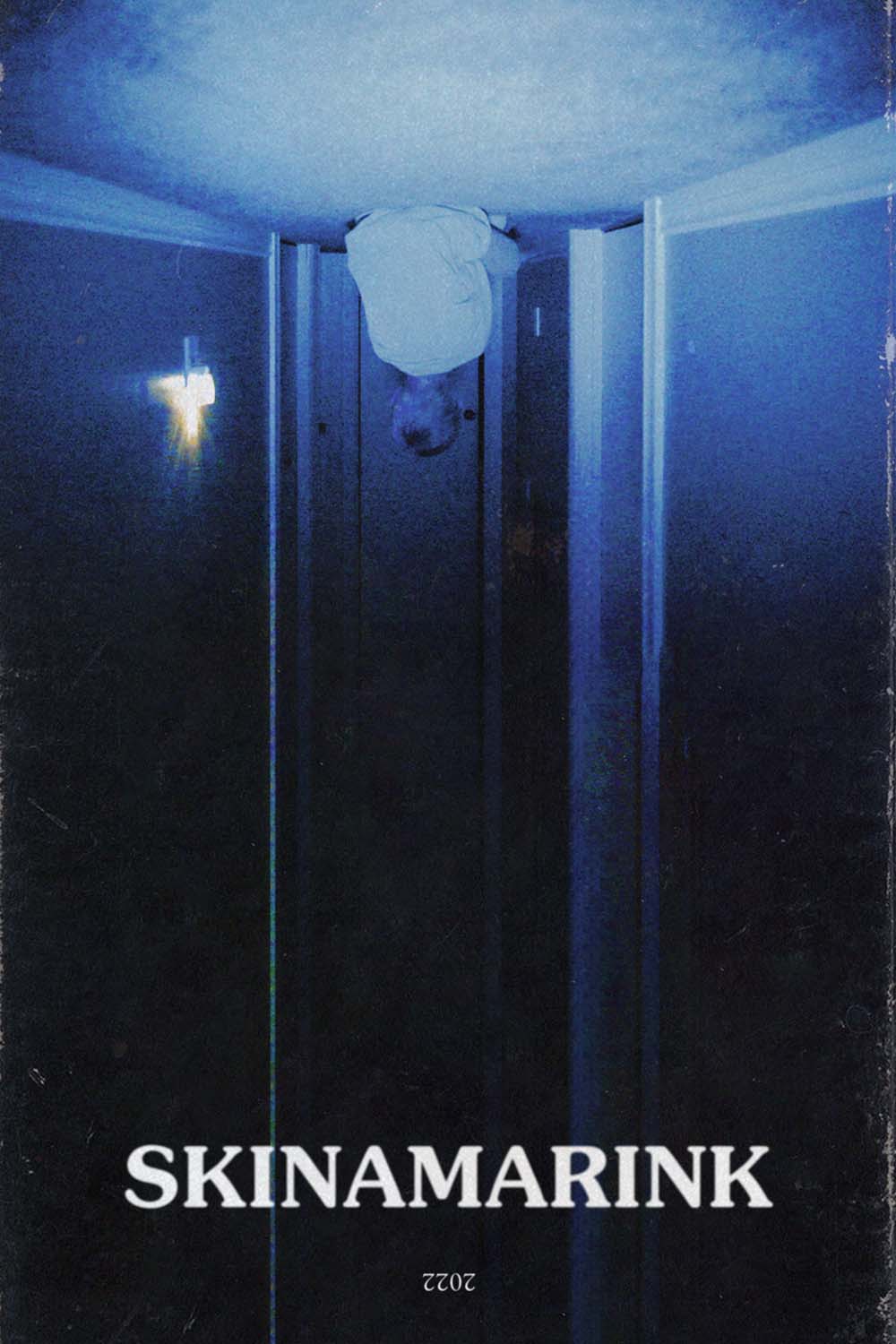 Upside down image of a boy in a hallway, staring at an opening door