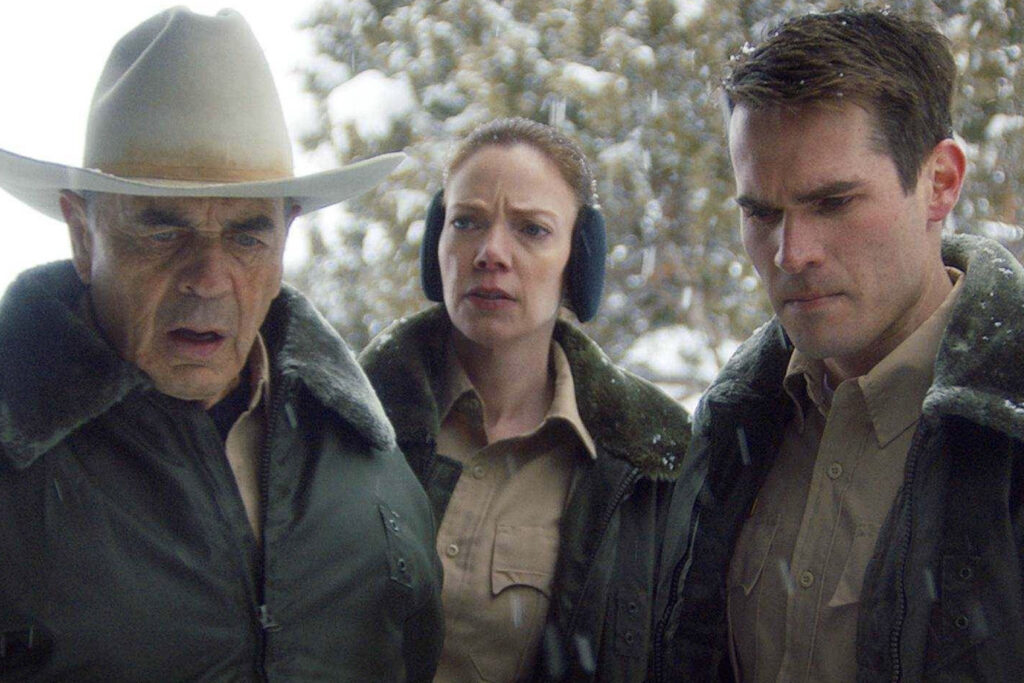 Three officers (Robert Forster as Sheriff Hadley, Riki Lindhome as Detective Robson, & Jim Cummings as Deputy Marshall) look in horror