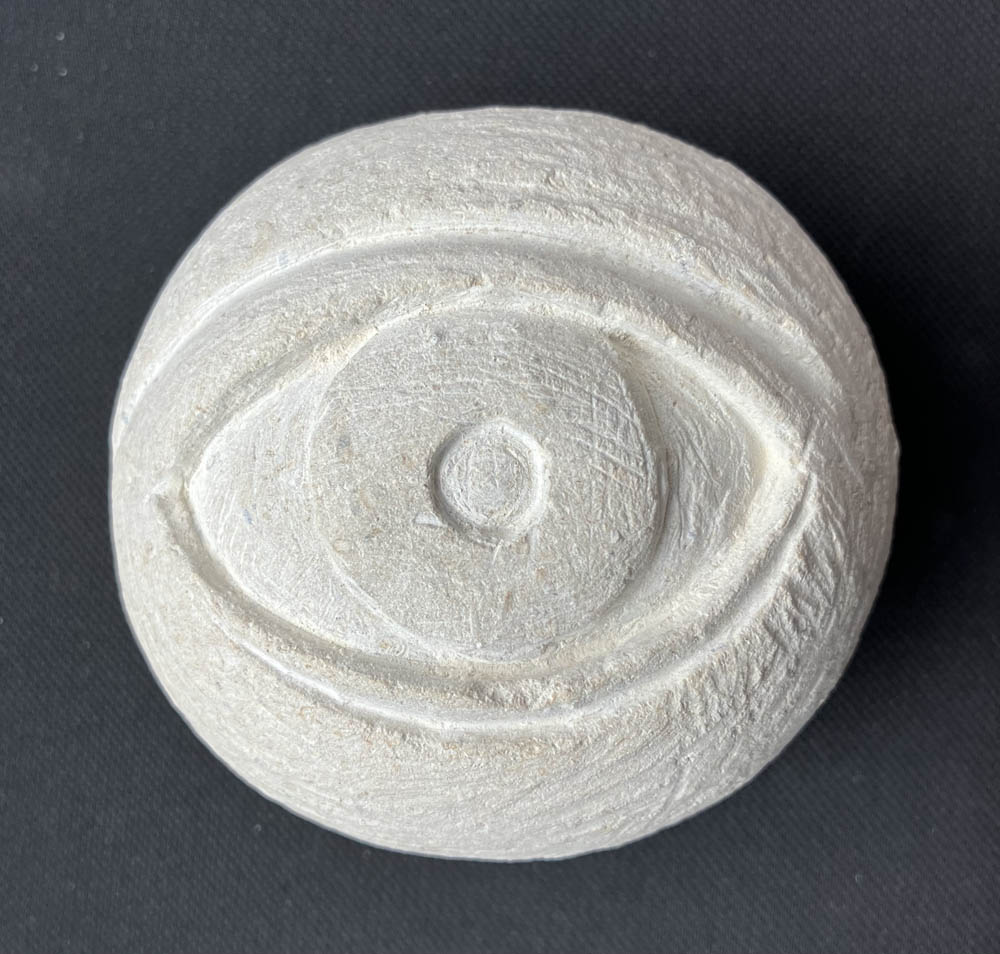 Carved stone eyeball by Jennifer Weigel
