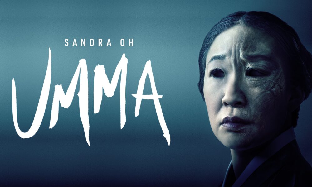 Sandra Oh staring to the side, her face covered in shadow from the left. Umma written in large font to the right.