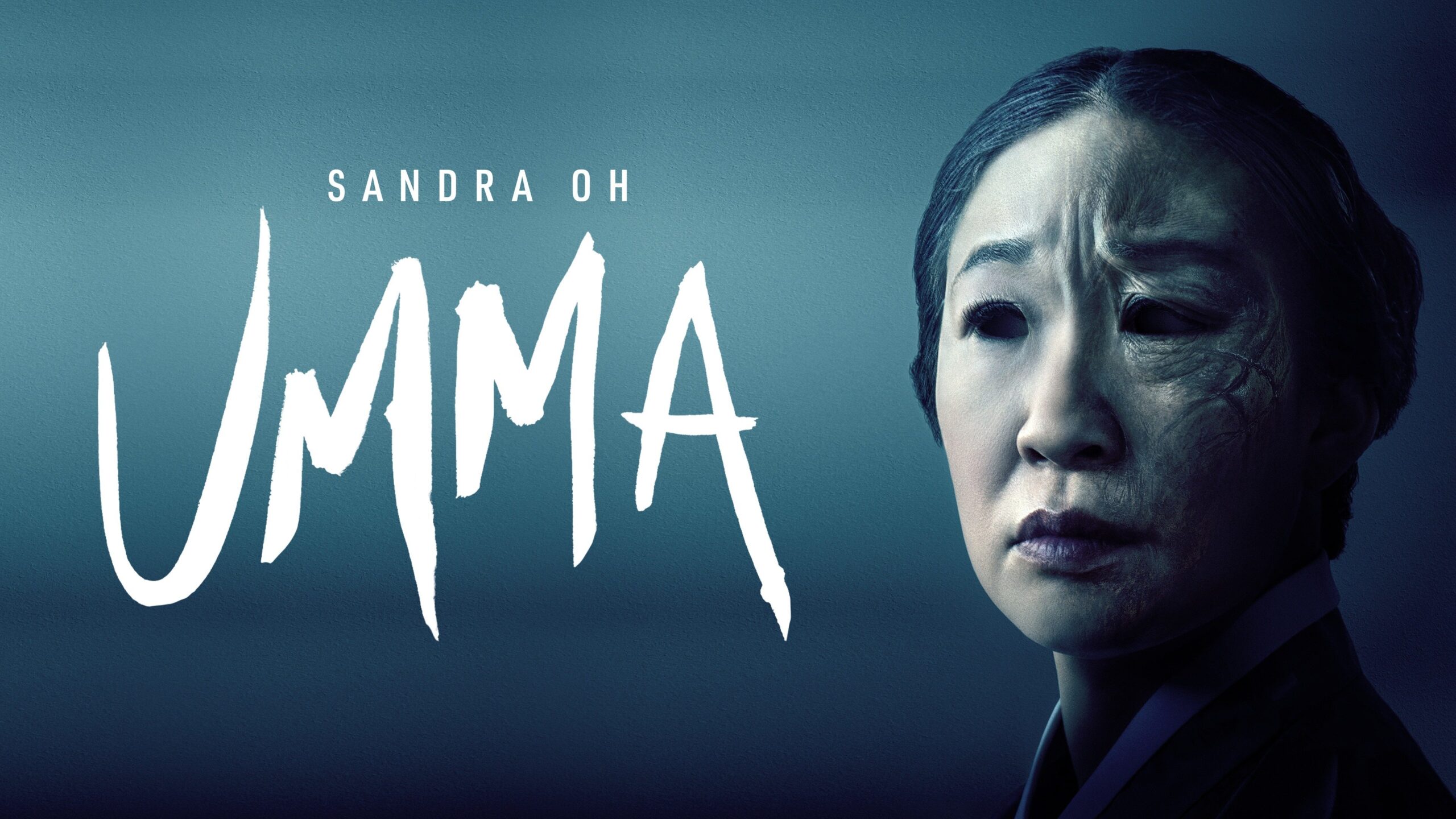 Sandra Oh staring to the side, her face covered in shadow from the left. Umma written in large font to the right.