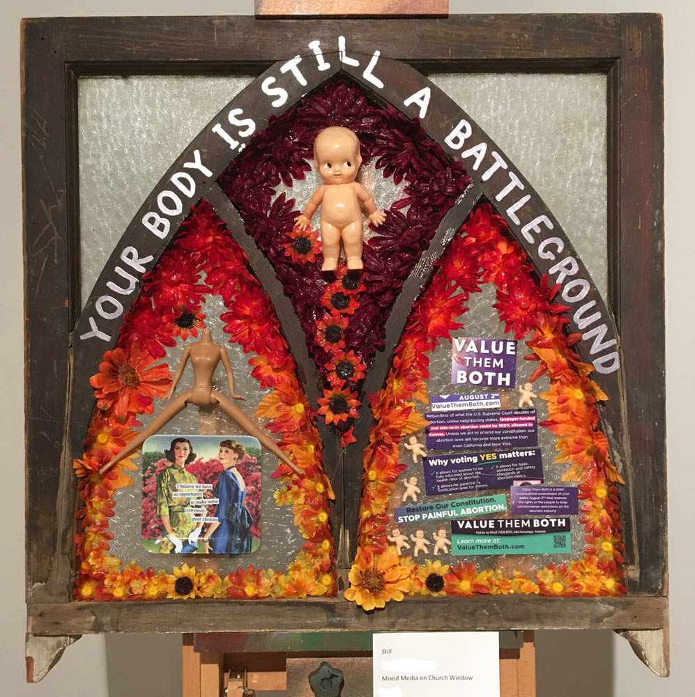 Still artwork, church window assemblage by Jennifer Weigel, reflecting on pro-choice versus pro-life politics in Kansas USA 2022 after the overturn of Roe v. Wade "Your body is still a battleground"