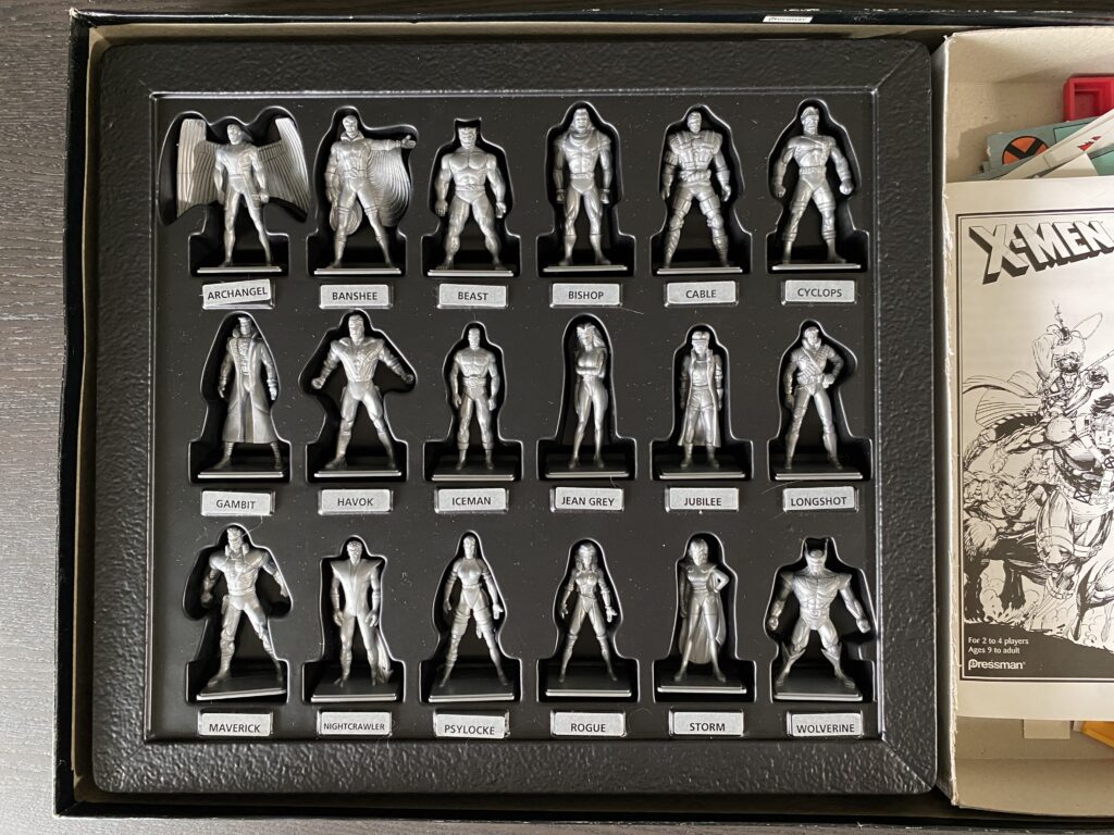 eighteen figurines from the X-Men Under Siege board game