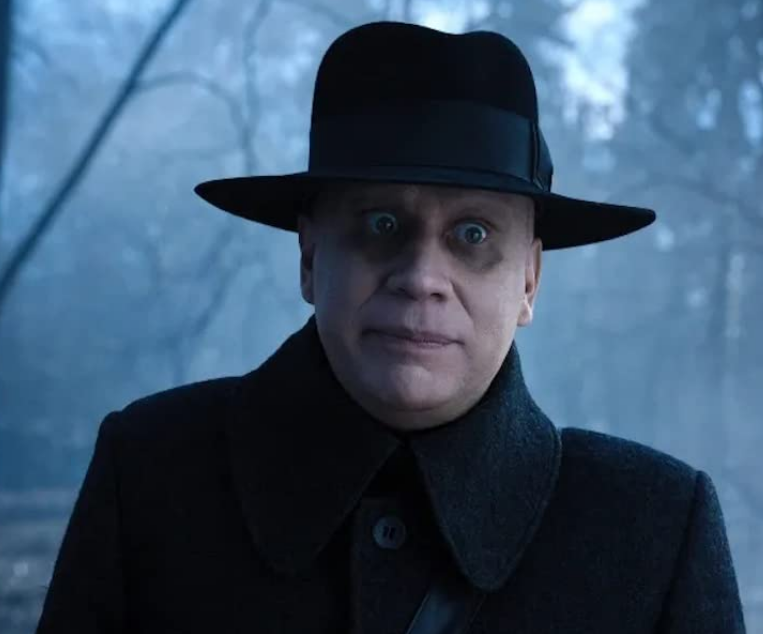 Fred Armisen as Uncle Fester in Wednesday. 
