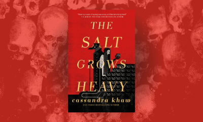 Linocut skulls on a red background with the cover of The Salt Grows Heavy by Cassandra Khaw