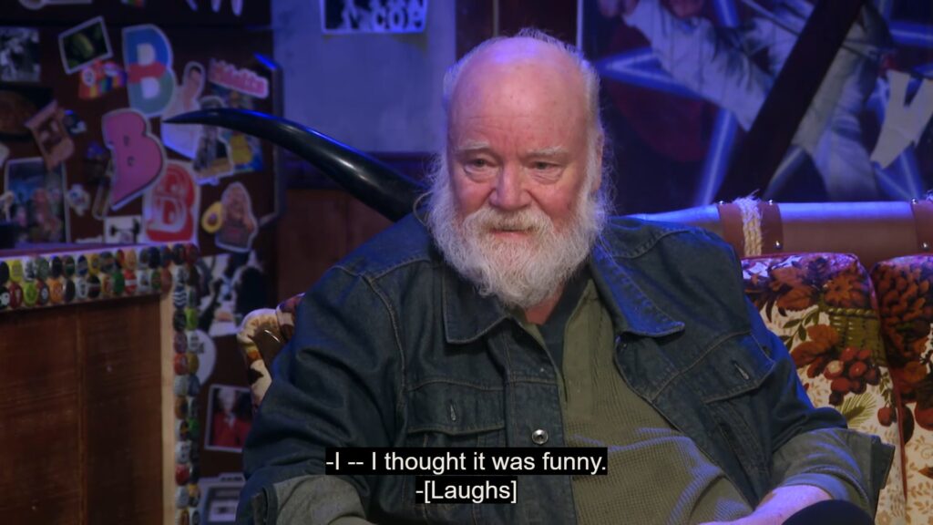 Phil Tippett sits on The Last Drive-In's interview couch. Tippett is saying, "I-I thought it was funny."