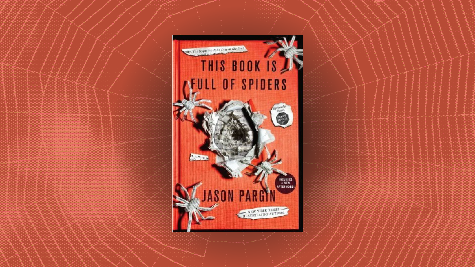 Spider webs behind the cover of a book with paper spiders spilling out of the front with the words This Book is Full of Spiders