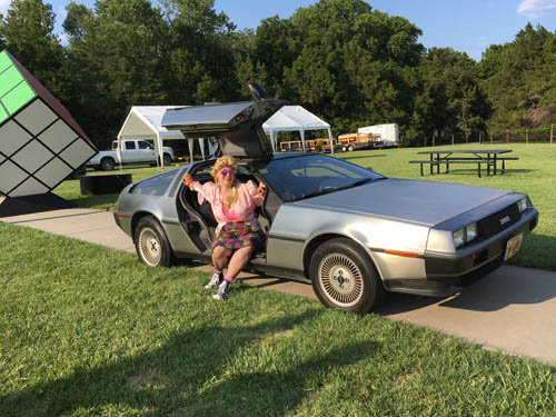 Jennifer Weigel emerges from the DeLorean Time Machine