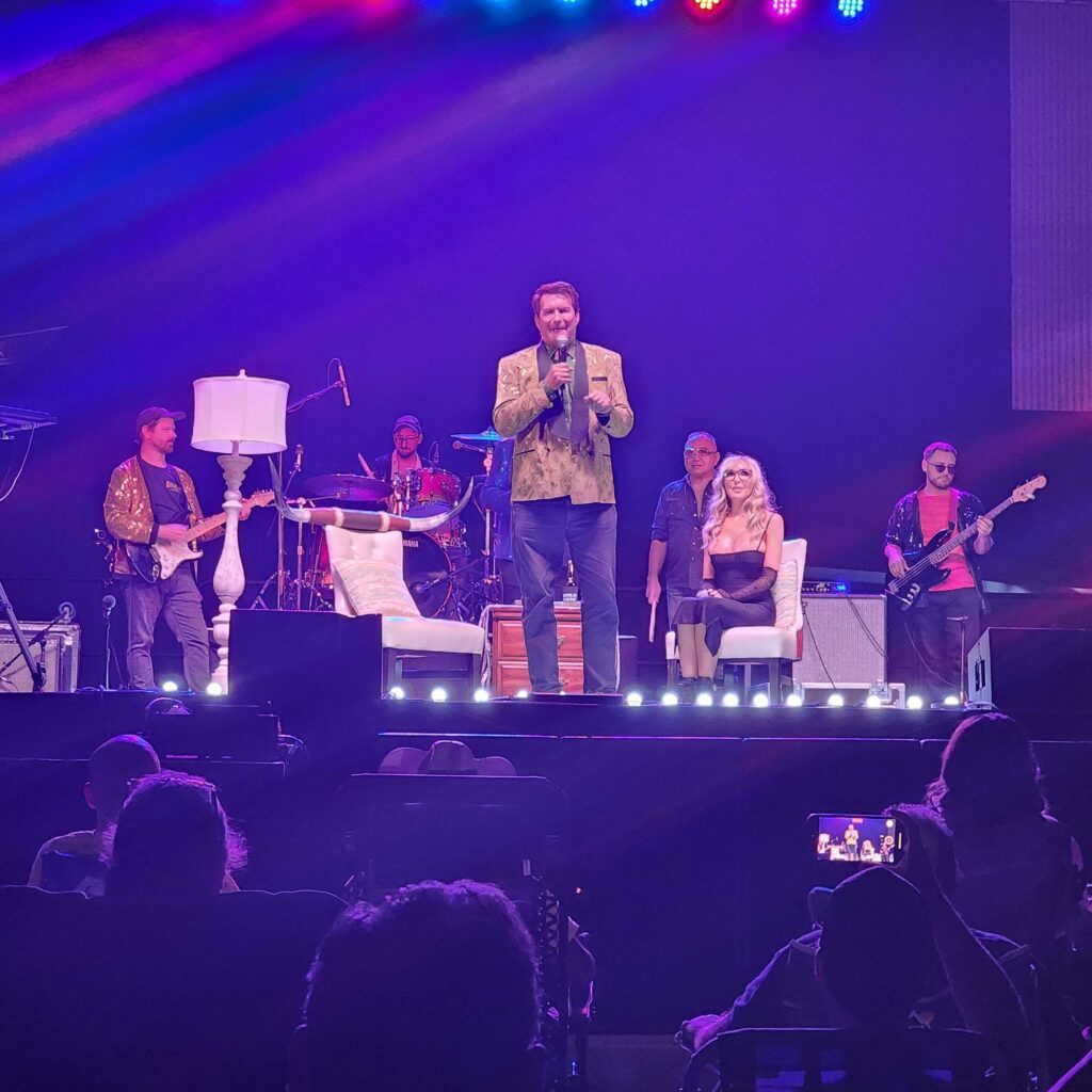 A photo of Joe Bob singing Viva Las Vegas on stage at the Jamboree.