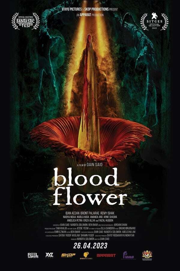 A flower opens up in a dark background. Underneath the white text reads "blood flower".