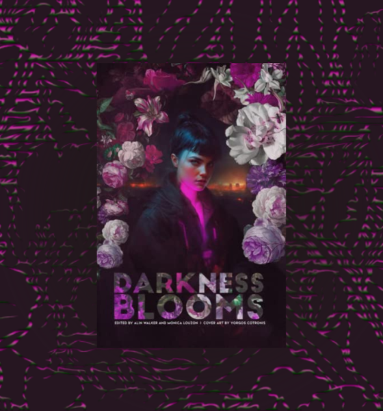 The words Darkness Blooms on a floral background with a woman standing looking at the viewer