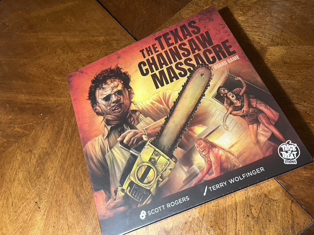 Box of The Texas Chainsaw Massacre by Trick or Treat Studios. Leatherface with a chainsaw features and screaming people in the background