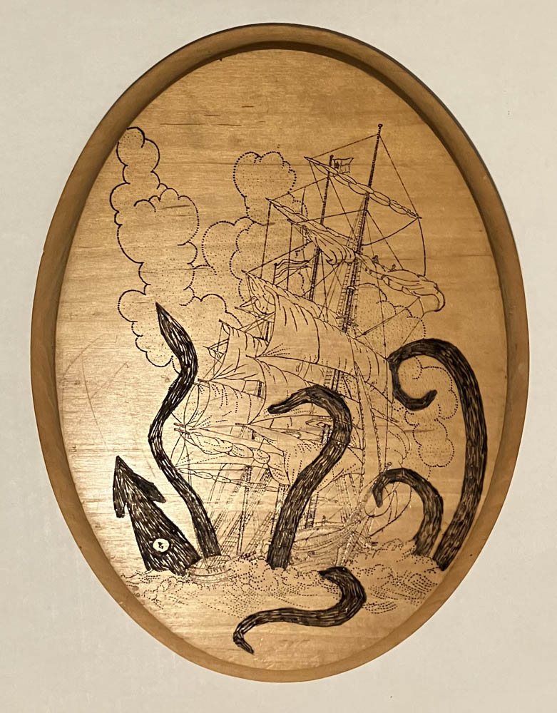 Woodburning of a giant squid latching onto a sailing ship with clouds or smoke in the background