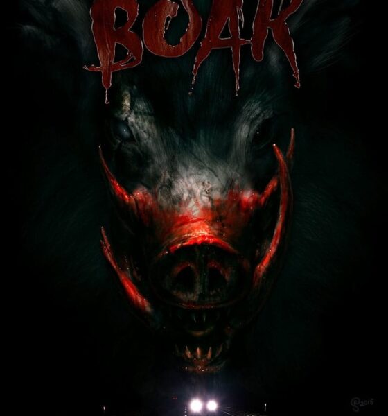 A creature with large tusks emerges from a darkness. Above its head reads Boar.