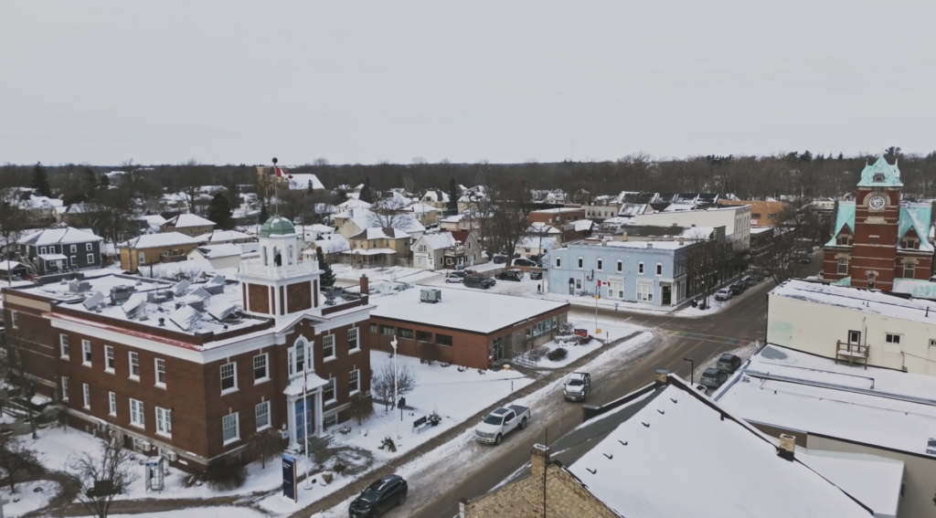 My Haunted Hometown - an arial view of a small town covered in snow