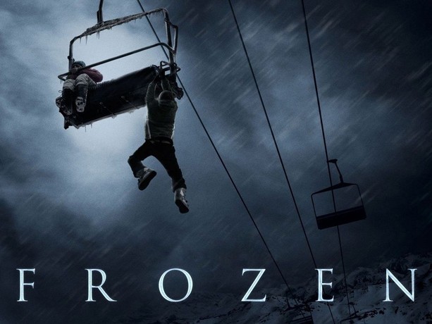 a man is hanging from a sky lift with a snowy forest background