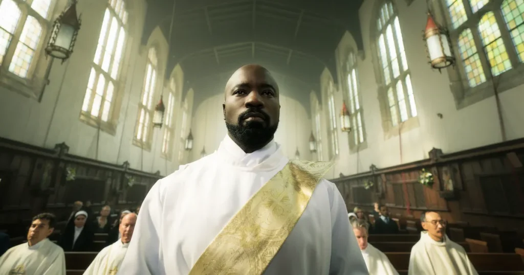 A man walks in ordination white, becoming a priest among other future priests. The background is a church