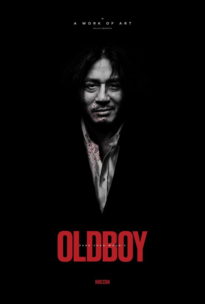 A man blending against a black background. He smugly smiles at the viewer. Below reads Oldboy in red