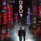 Among colorful neon signs light up both sides of the poster. Between reads Oldboy, written vertically. A man and woman walk underneath it all, looking lost and small.