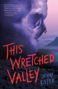 This Wretched Valley book cover. Purple cliff shed like a skull with climber hanging