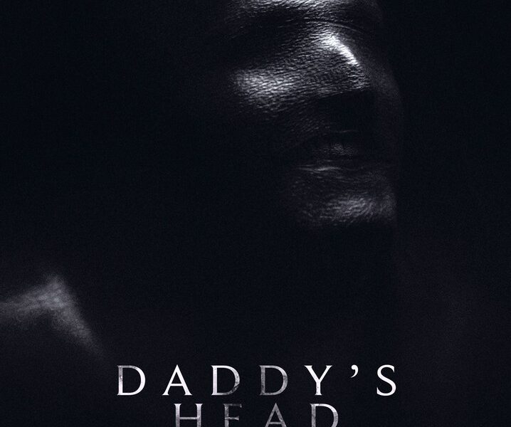 Daddy's Head appears in a dark background. A face emerges from the darkness, looking away from the viewer.