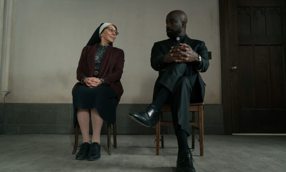 Sister Andrea and Father David Acosta prepare her defense