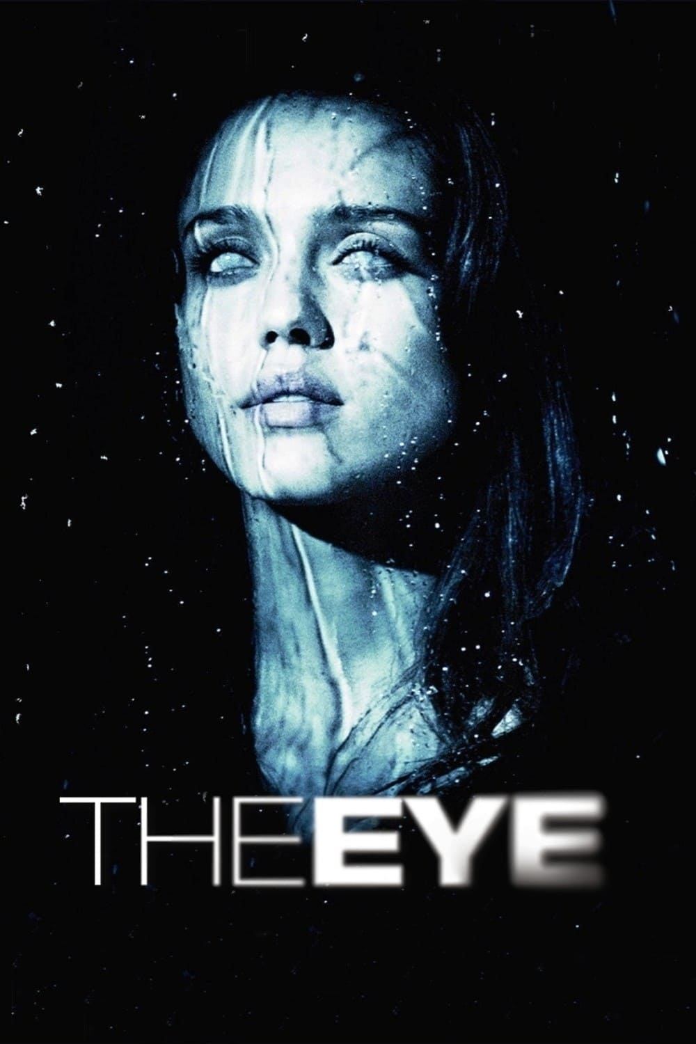 A woman with white eyes faces her right, slighly off from the viewer. There's a blue tint that makes her appear pale. Below reads "The Eye."